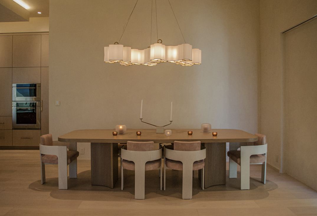 Dining room with sculptural pendant chandelier