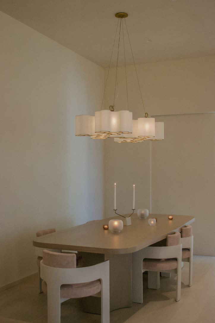 Dining table set with candles and pendant chandelier